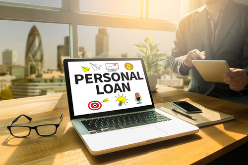 Image of the word Personal Loan on a laptop wallpaper